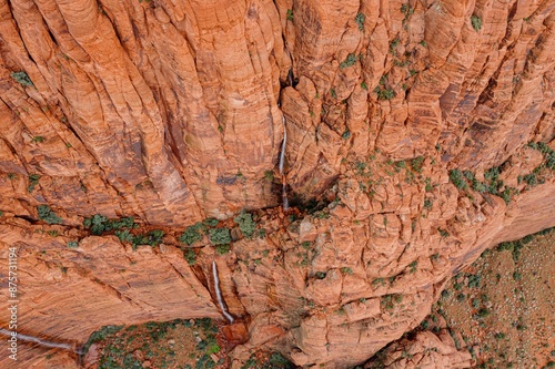 Rocky mountain cliff with waterfall going down it aftr a summer rain. Ivins, Utah, United States of America. photo