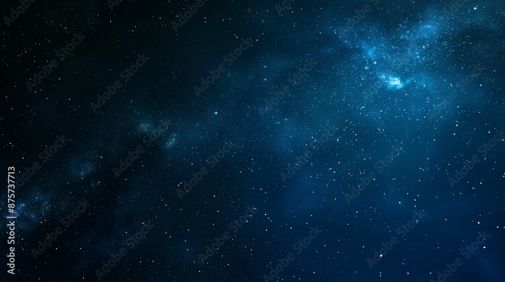 Fototapeta premium A cosmic gradient background blending deep space blue with starry night black, adding a mysterious and expansive feel to creative projects.