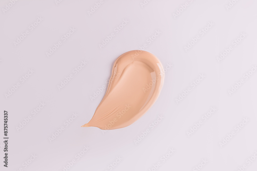 Fototapeta premium A sample, a stroke of foundation powder in a natural tone. cosmetic swatch. Mockup for the design of the cosmetic texture of the product