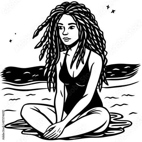 a girl with dreadlocks sitting on mthe beach photo