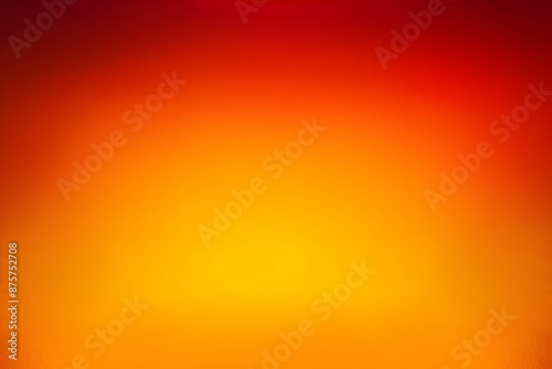 Vibrant gradient backdrop blending fiery red and warm yellow hues photo