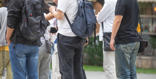 Tourists in a backpack in the city.