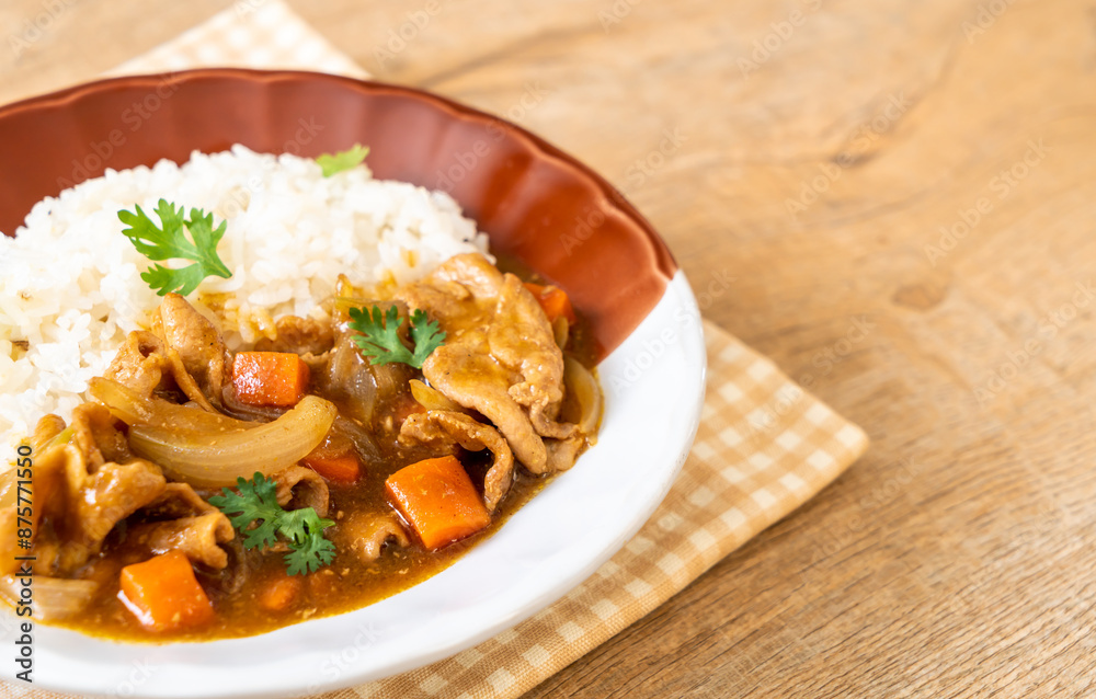 Japanese curry rice with sliced pork, carrot and onions Japanese curry rice with sliced pork, carrot and onions