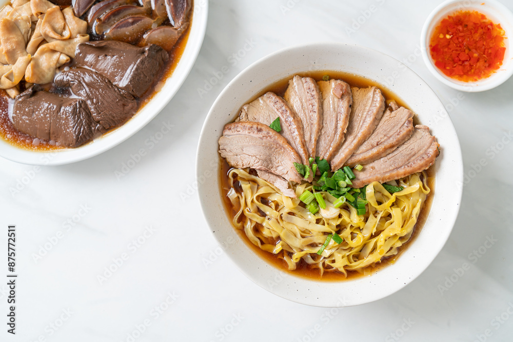 egg noodles with stewed duck in brown soup egg noodles with stewed duck in brown soup