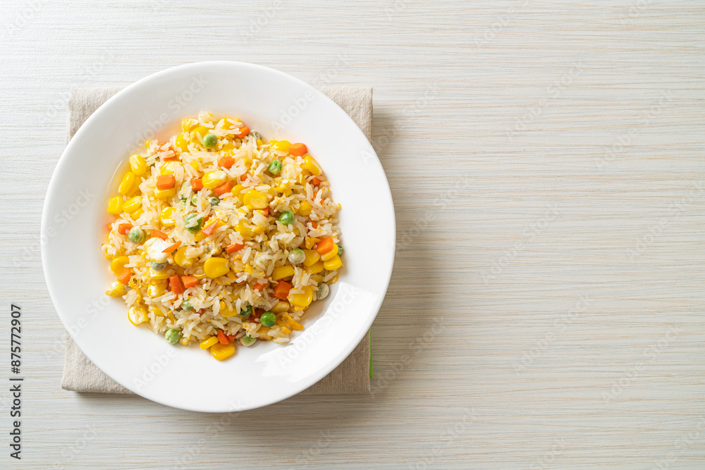 fried rice with mixed vegetable (carrot, green bean peas, corn) and egg fried rice with mixed vegetable (carrot, green bean peas, corn) and egg