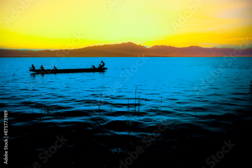 Beautiful evening view of the lake and mountains at Kwan Phayao photo