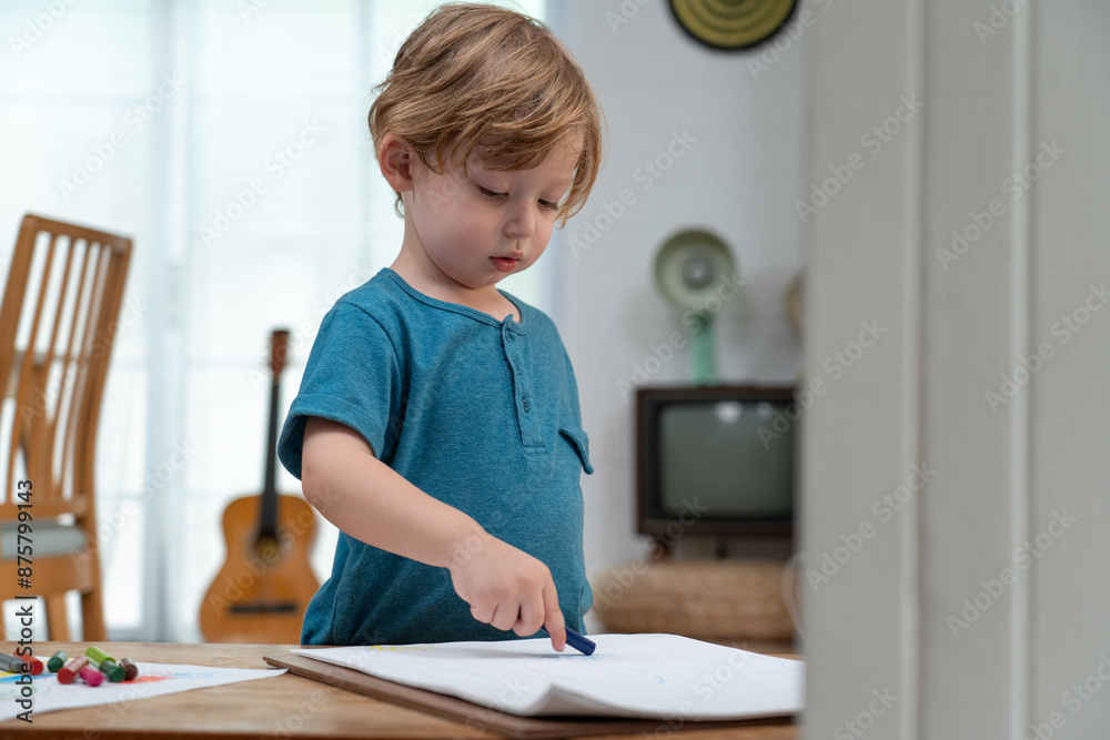 Happy moment little cute boy creating and water color painting activity with paint brushes on frame canvas at living room. Kids activity. Child physical. Emotional. Cognitive development concept. Happy moment little cute boy creating and water color painting activity with paint brushes on frame canvas at living room. Kids activity. Child physical. Emotional. Cognitive development concept.