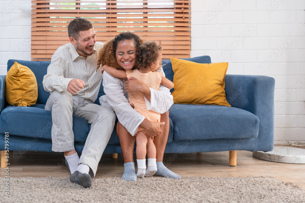 Family. Happy family with little daughte having fun at home. Smiling young parents and their child are very happy. Parenthood and people concept. Family. Happy family with little daughte having fun at home. Smiling young parents and their child are very happy. Parenthood and people concept.