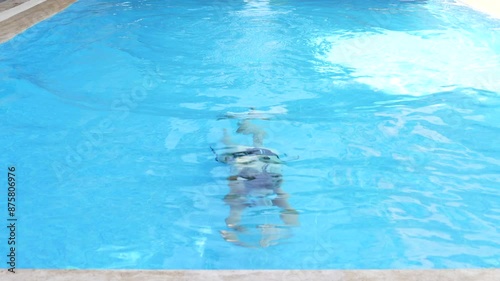 beautiful girl swimming in the pool