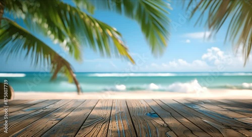 A mock-up of an empty wooden table with a place to copy text, against the background of a summer beach, sea, waves, pool, green palm trees around.