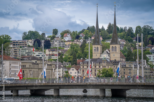 amazing beautiful city where tourist can see architecture old town city cow , river cruising wooden bridge at Lucerne Switzerland   photo