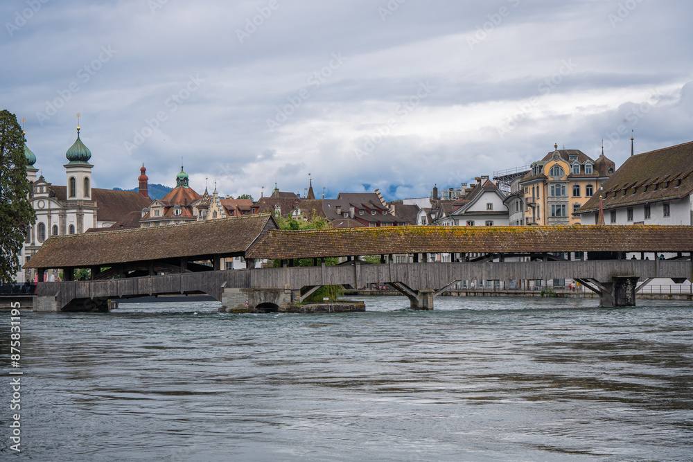 amazing beautiful city where tourist can see architecture old town city cow , river cruising wooden bridge at Lucerne Switzerland  