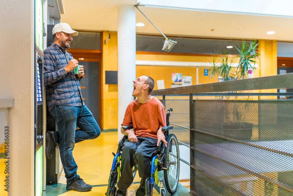 Man with disability and coworker next to a vending machine Man with disability and coworker next to a vending machine