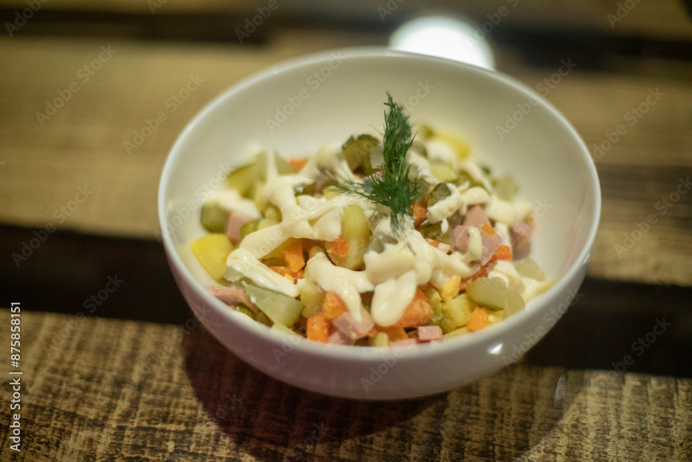 Salad with mayonnaise. Salad in plate. Olivier on table. Salad with mayonnaise. Salad in plate. Olivier on table.