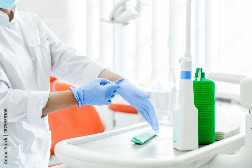 Dentist Putting On Blue Medical Gloves Dentist Putting On Blue Medical Gloves