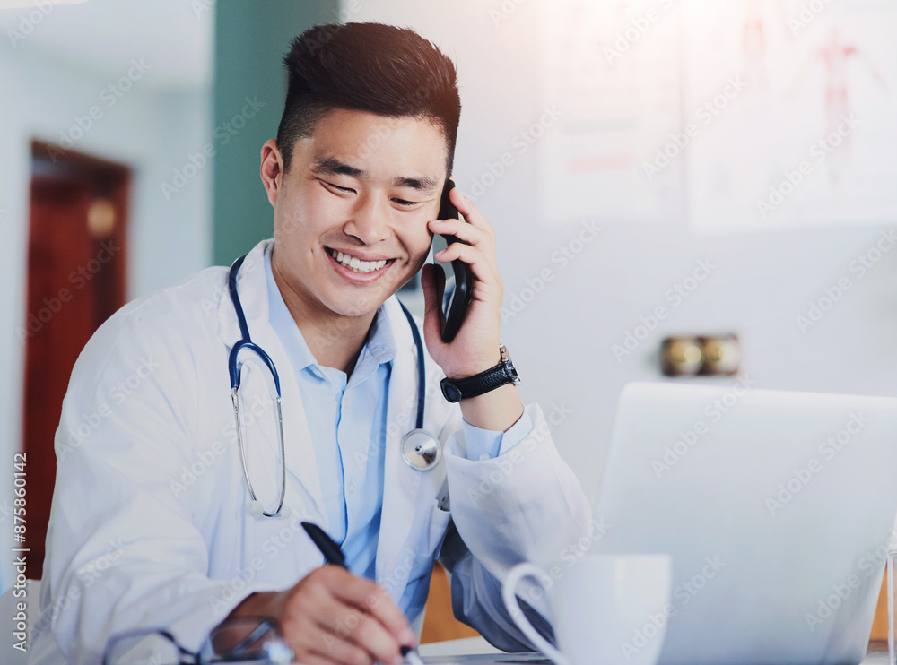 Healthcare, laptop and phone call with doctor writing in office of hospital for appointment or schedule. Computer, notepad and smile with asian medicine professional in clinic for consultation
