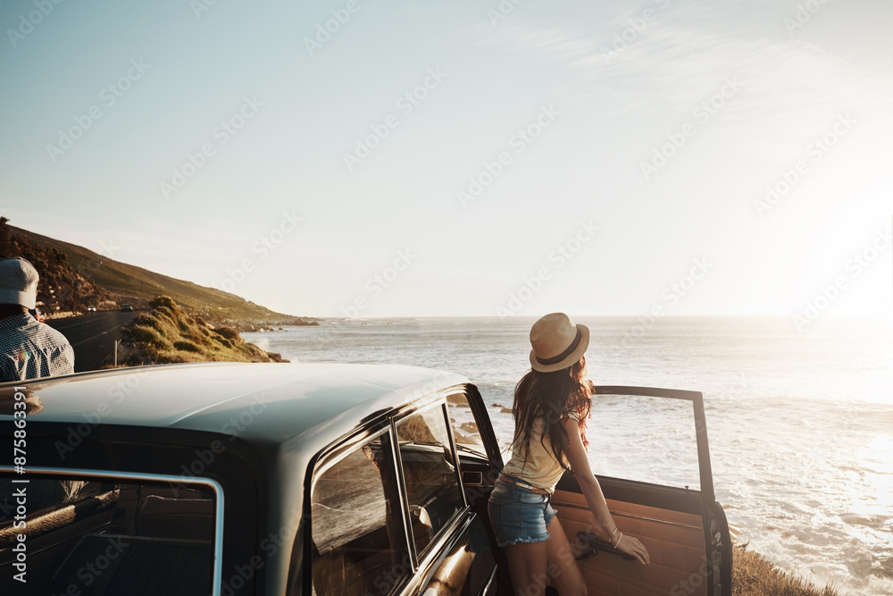 Fototapeta premium Car, travel and couple with view at beach for summer vacation, anniversary and sunset in Norway. Holiday, drive and woman by ocean on road trip for tourism, romantic adventure and outdoor sightseeing