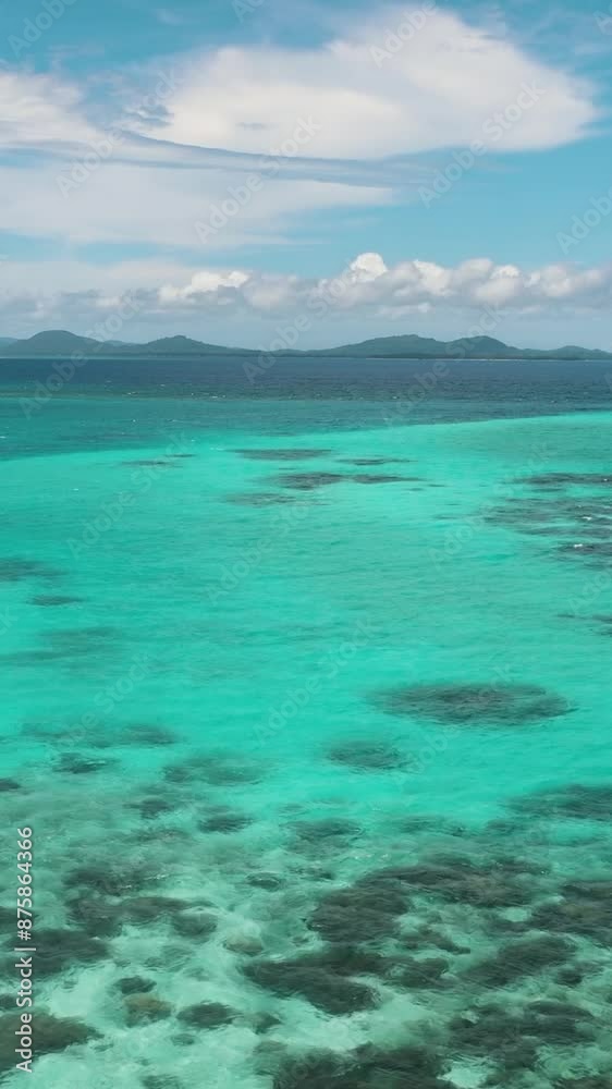 Aerial view of Turquoise lagoon surface and coral reef view from above. Seascape. Aerial view of Turquoise lagoon surface and coral reef view from above. Seascape.