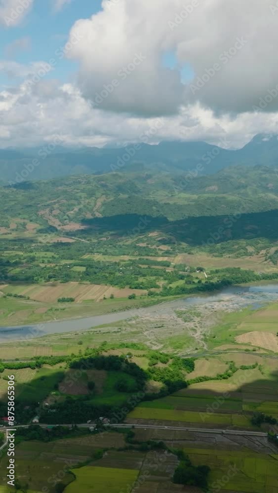 Aerial drone of Mountain slopes with rainforest and a mountain valley with farmland. Philippines. Aerial drone of Mountain slopes with rainforest and a mountain valley with farmland. Philippines.