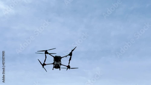 Agriculture drone fly to sprayed fertilizer on the sweet corn fields. Drone transporter