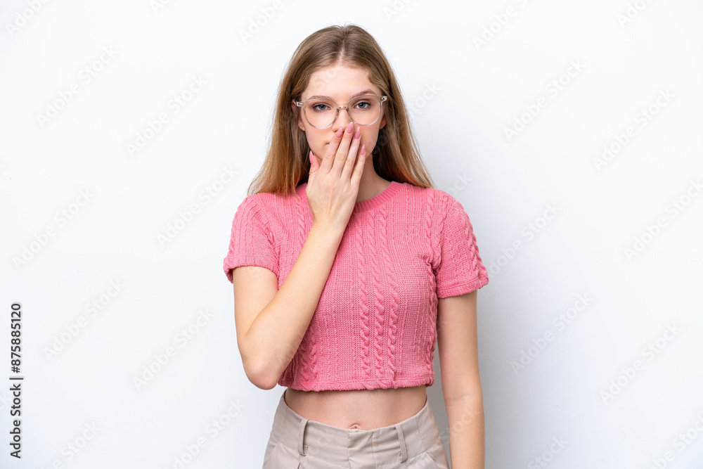 Teenager Russian girl isolated on white background covering mouth with hand Teenager Russian girl isolated on white background covering mouth with hand