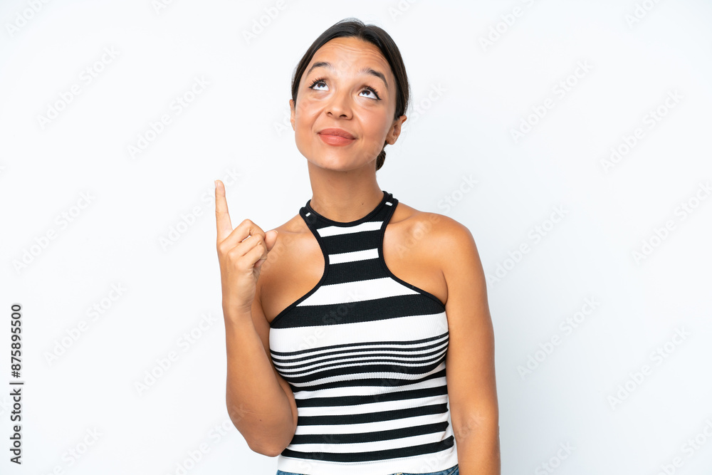 Young hispanic woman isolated on white background pointing up and surprised Young hispanic woman isolated on white background pointing up and surprised
