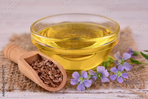 Healthy flax seed oil in a glass bowl.Close-up.
