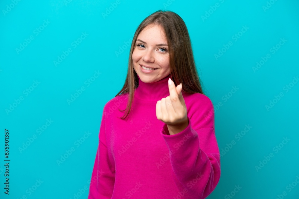 Fototapeta premium Young Lithuanian woman isolated on blue background making money gesture