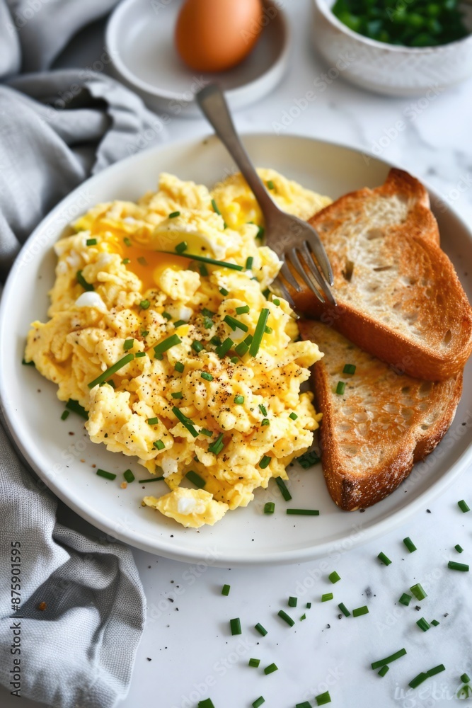 A plate of scrambled eggs with toast and parsley on top A plate of scrambled eggs with toast and parsley on top