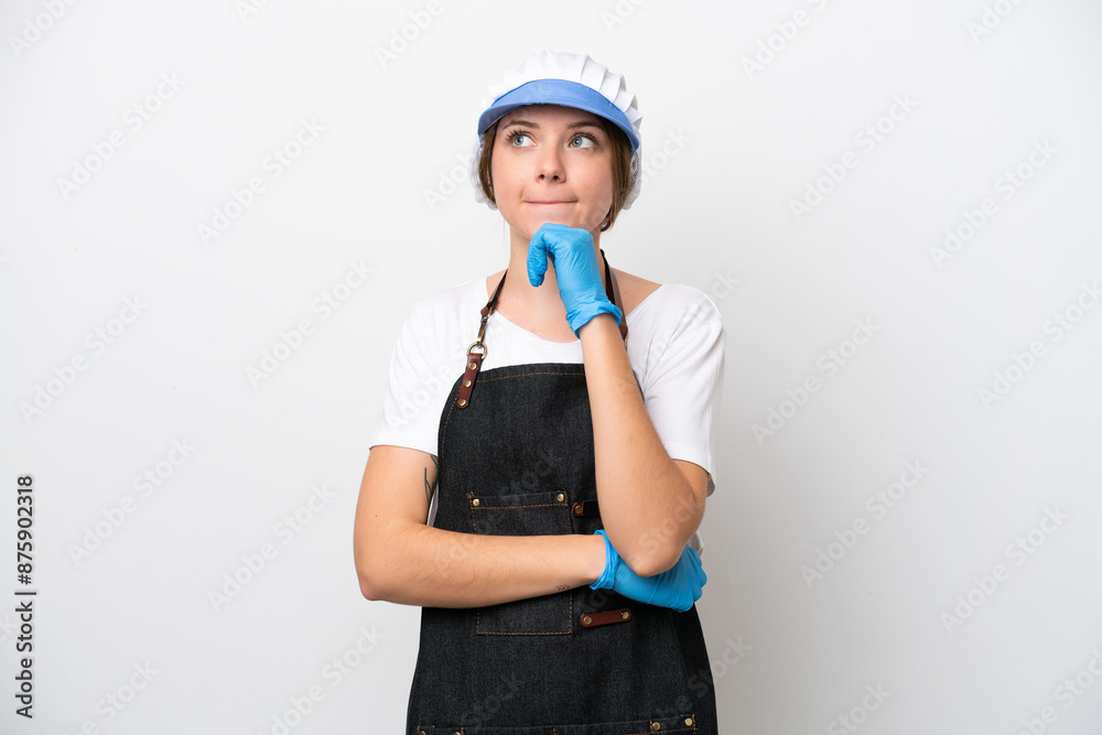 Fishmonger woman wearing an apron having doubts and thinking Fishmonger woman wearing an apron having doubts and thinking
