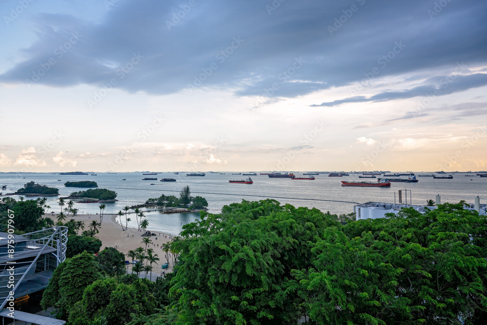 Obraz premium Siloso Beach Singapore, view from Fort Siloso skywalk, ships in Singapore strait shipping channel, tourist tourism travel destination holiday vacation