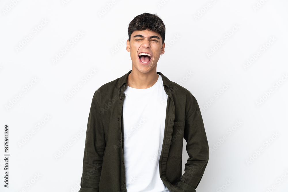 Young man over isolated white background shouting to the front with mouth wide open Young man over isolated white background shouting to the front with mouth wide open