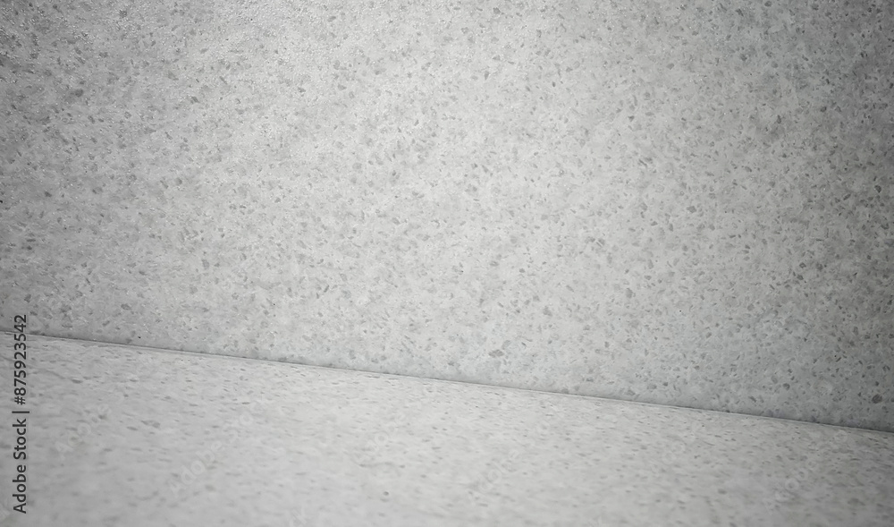 Fototapeta premium grey concrete studio background for product placement or website. close up grainy concrete room for advertising. wall interior background, studio and backdrops.