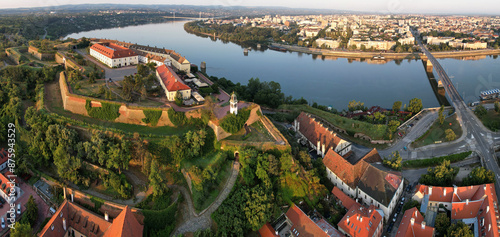 Panoramic aerial view of Petrovaradin Fortress, Danube river and Novi Sad town at sunrise. Serbia.