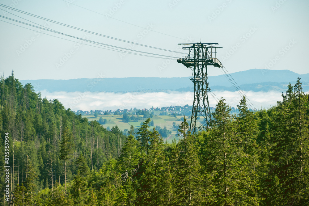 Cable car tower in the mountains. Mountain lift. Summer holidays in the mountains. Tatra Mountains Cable car tower in the mountains. Mountain lift. Summer holidays in the mountains. Tatra Mountains