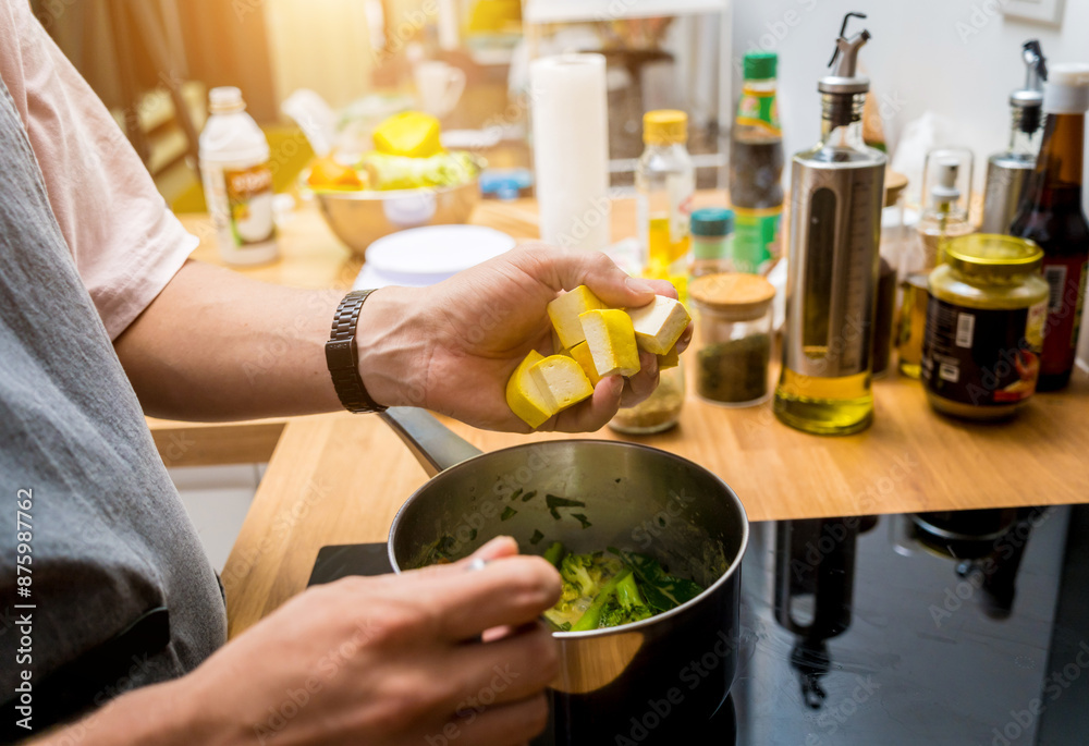 Chef at the kitchen preparing green curry with herbs and rice Chef at the kitchen preparing green curry with herbs and rice