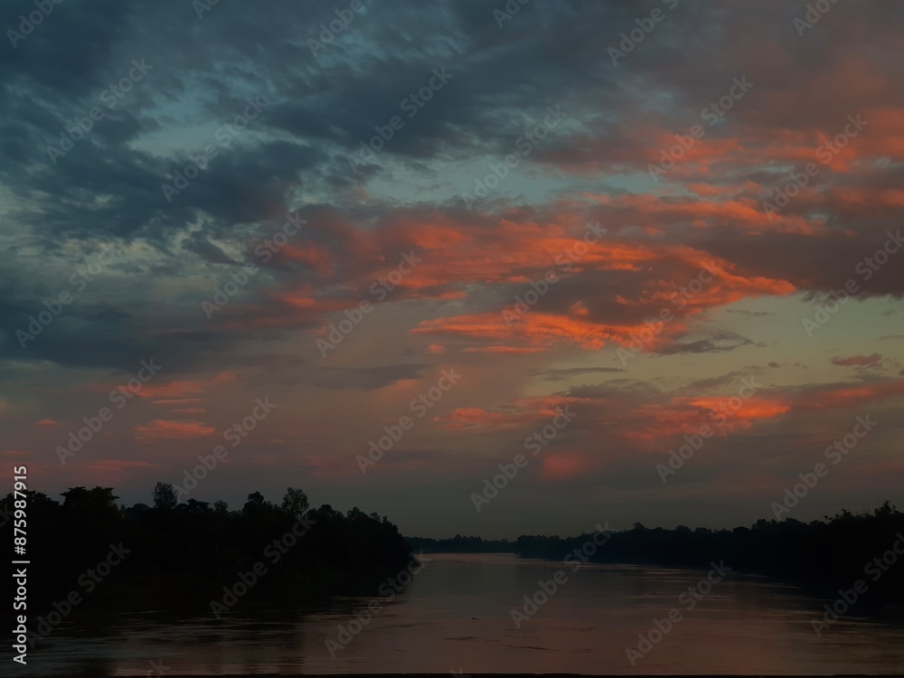 Fototapeta premium Beautiful sunset over the river with trees