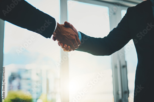 Business people, collaboration and shaking hands in office for agreement, deal negotiation and b2b partnership. Employees, closeup handshake and welcome for we are hiring, recruitment and onboarding photo