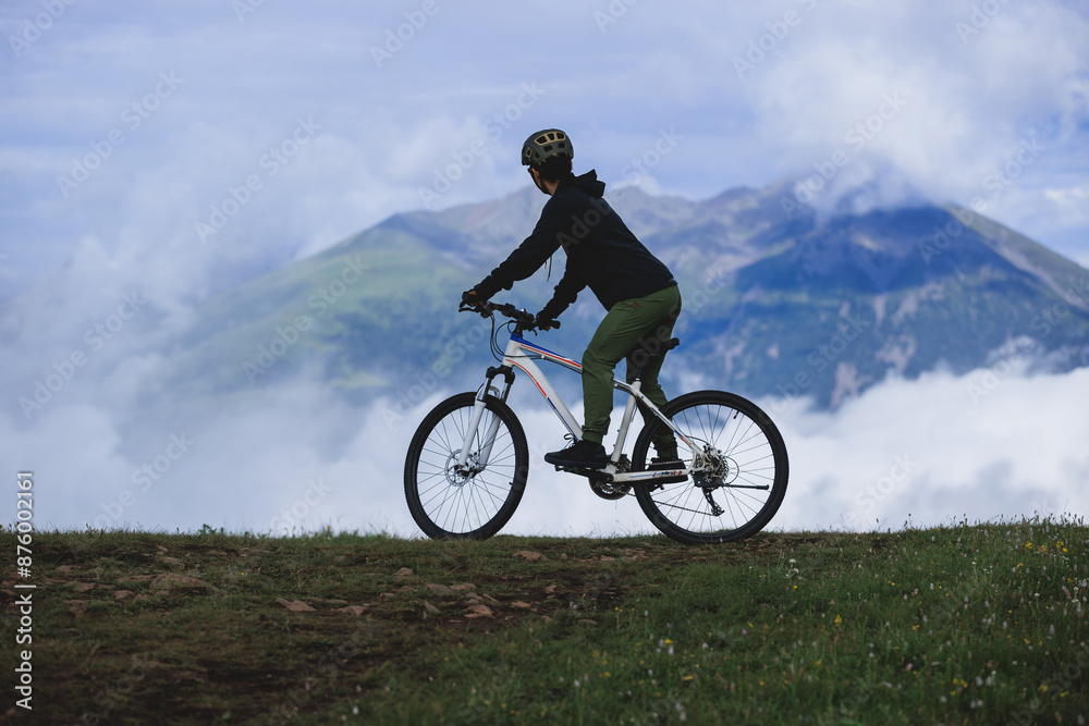 Riding mountain bike on beautiful mountain top Riding mountain bike on beautiful mountain top