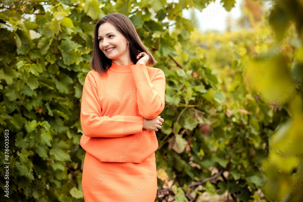 Close-up portrait of young beautiful woman with vineyard background, copy space. Close-up portrait of young beautiful woman with vineyard background, copy space.