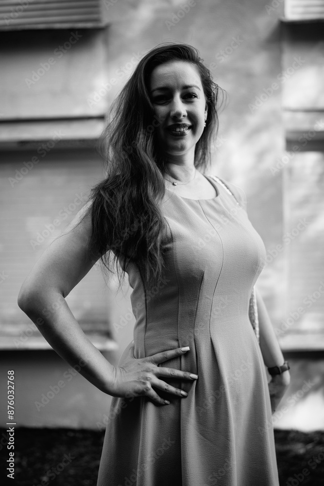 Naklejka premium Portrait of a young beautiful dark-haired girl in nature in black and white style.