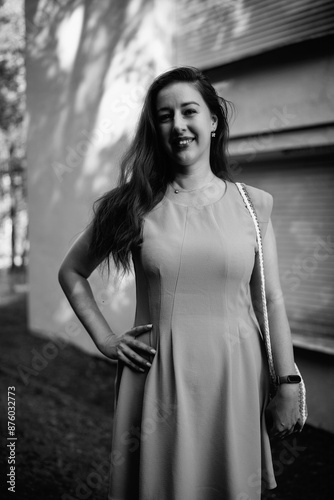 Portrait of a young beautiful dark-haired girl in nature in black and white style.