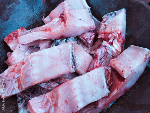 Fish pieces in a frying pan fishmeat fishflesh cut sliced machhalee, raw pesce, pescado, piece closeup image stock photo
 photo