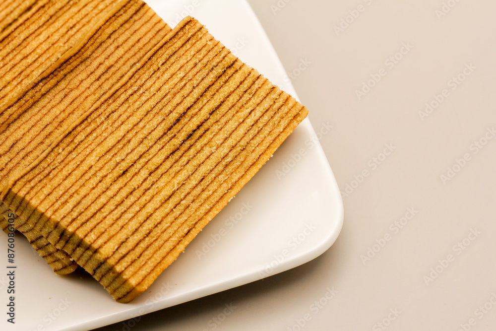 Slices of Indonesian Lapis Cake against dark background. Layered cake. Thousand Layer Cake. In Indonesia known with Slices of Indonesian Lapis Cake against dark background. Layered cake. Thousand Layer Cake. In Indonesia known with