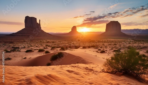 A desert landscape with a sunset in the background 