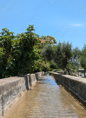 View of an open-air section of the Beal, an aqueduct carrying water to Hyeres in southern Provence, La Crau, France photo