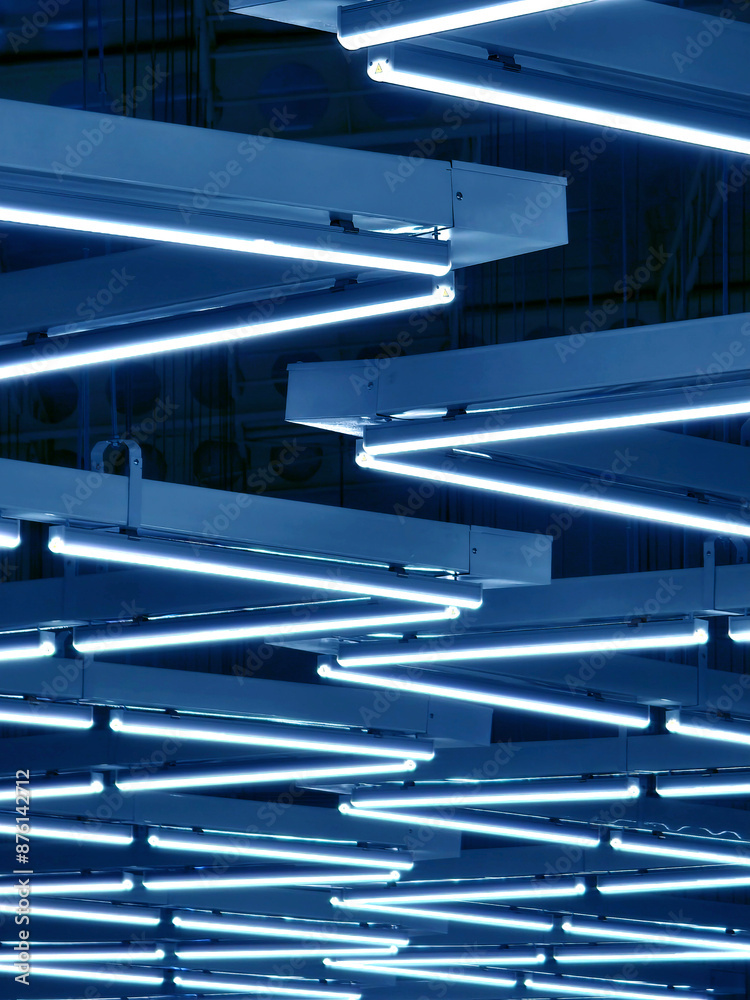 Obraz premium Ceiling with pipes is beautifully decorated with many industrial lamps