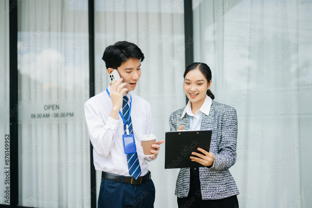 Businessman and woman going in city center in smart casual business style, talking, working together, stylish freelance people Businessman and woman going in city center in smart casual business style, talking, working together, stylish freelance people