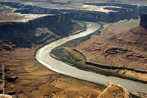 Majestic aerial view of a meandering river flowing through a canyon photo