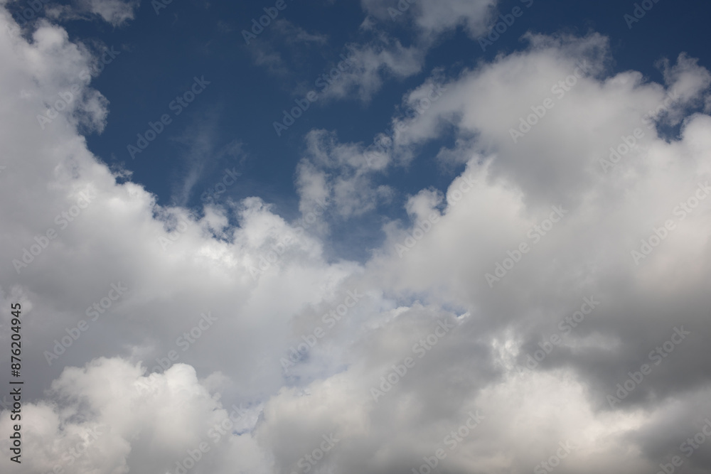 Blue sky. Beautiful Cumulus clouds flying across the sky,